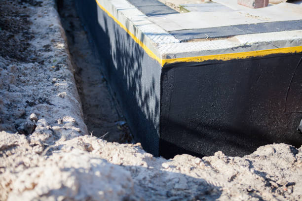 Professional Waterproofing technician working in Fair Haven, NY